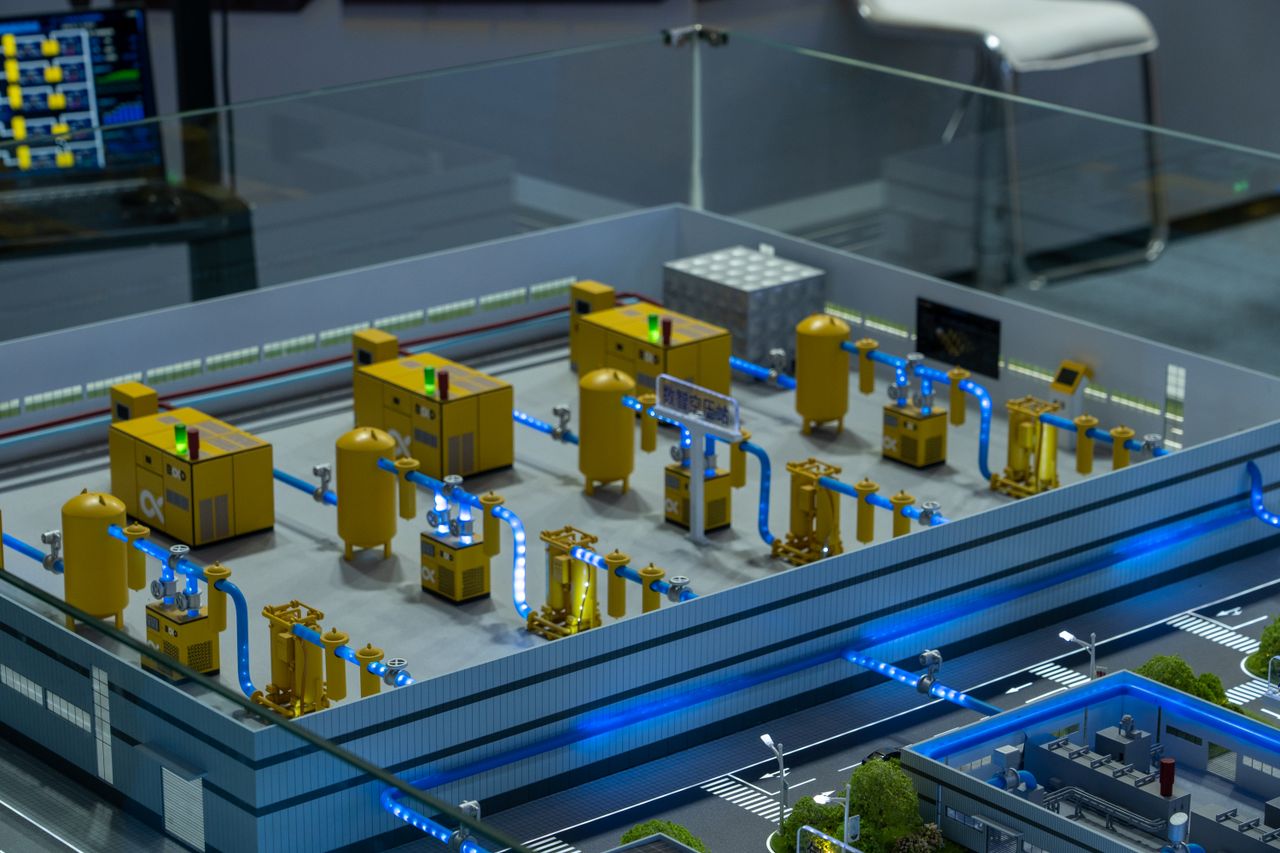 Crafting Captivating Headlines: Your awesome post title goes here Detailed industrial model display showcasing machinery and systems indoors, emphasizing technology and design.